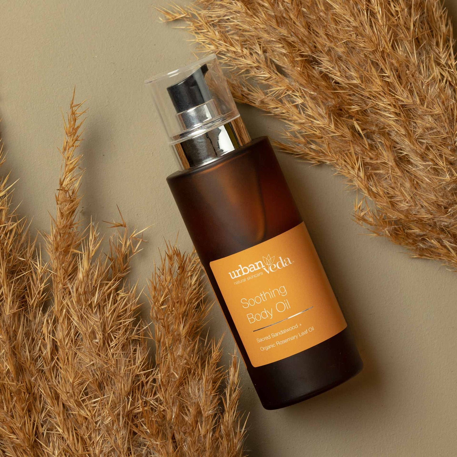 best body oil for dry skin, Urban Veda Amber bottle against a light background