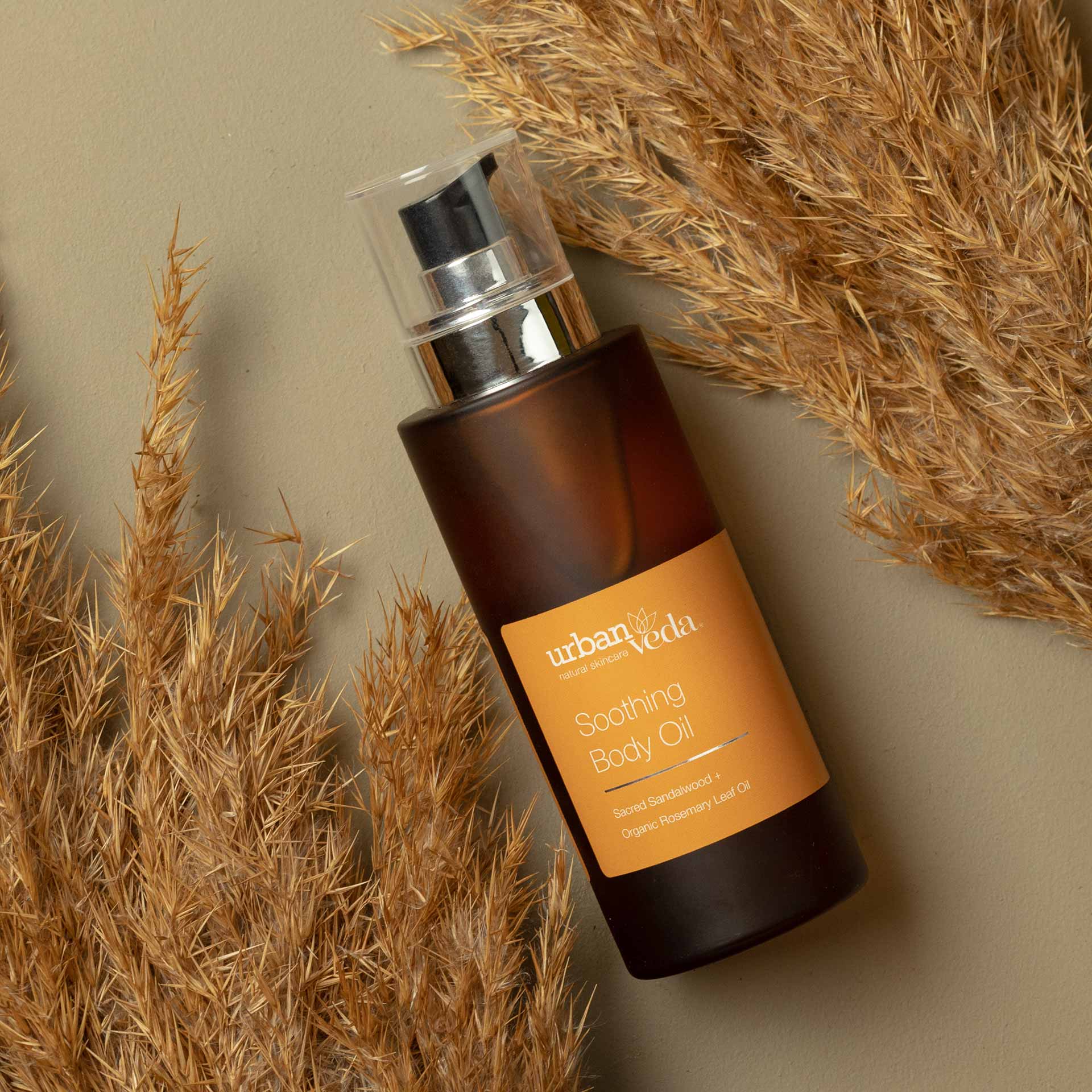 best body oil for dry skin, Urban Veda Amber bottle against a light background